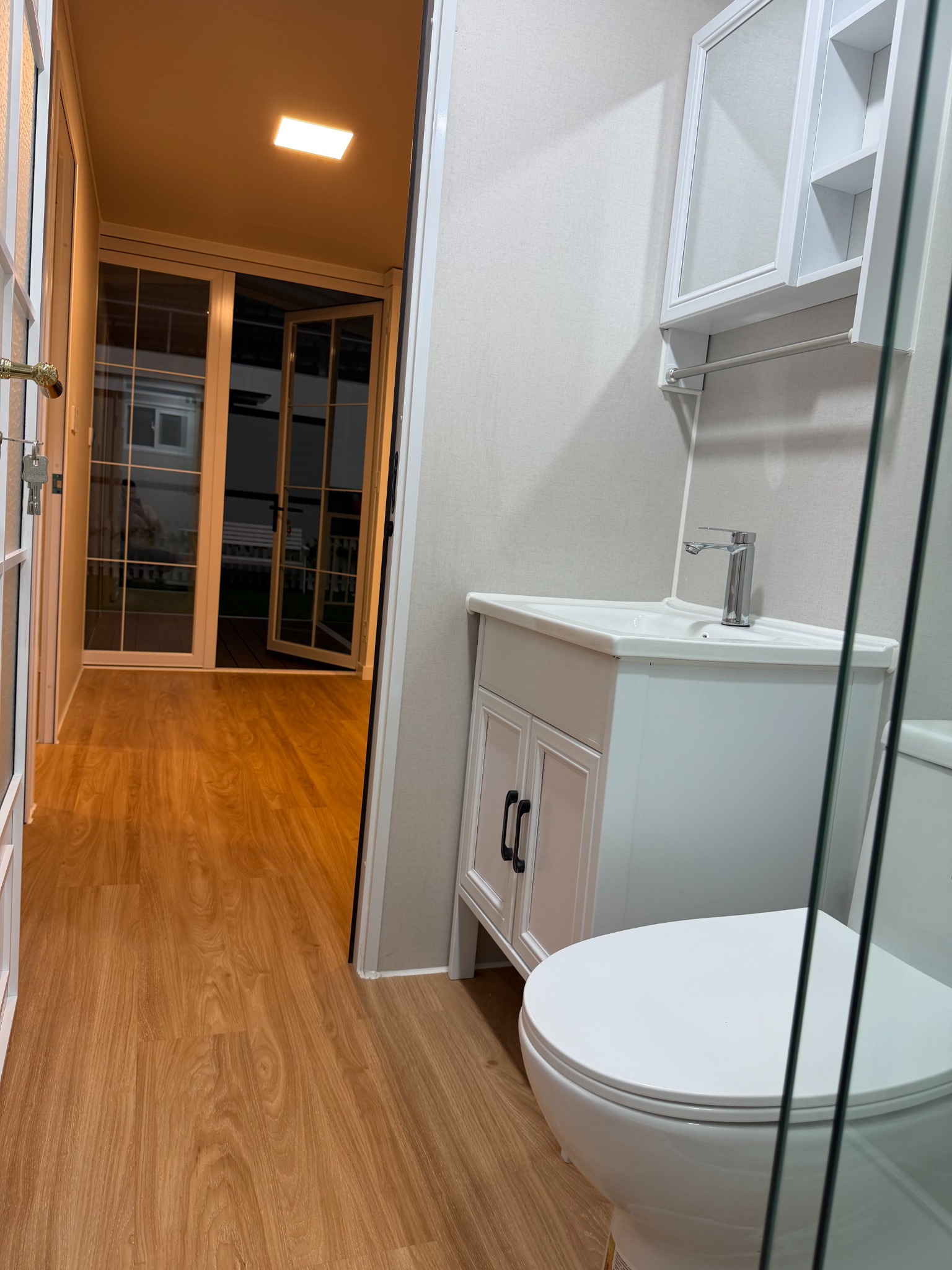Expandable container house bathroom vanity and toilet interior