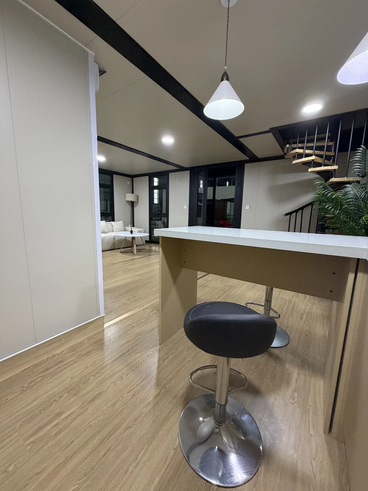 Kitchen bar and staircase view in double-storey expandable house