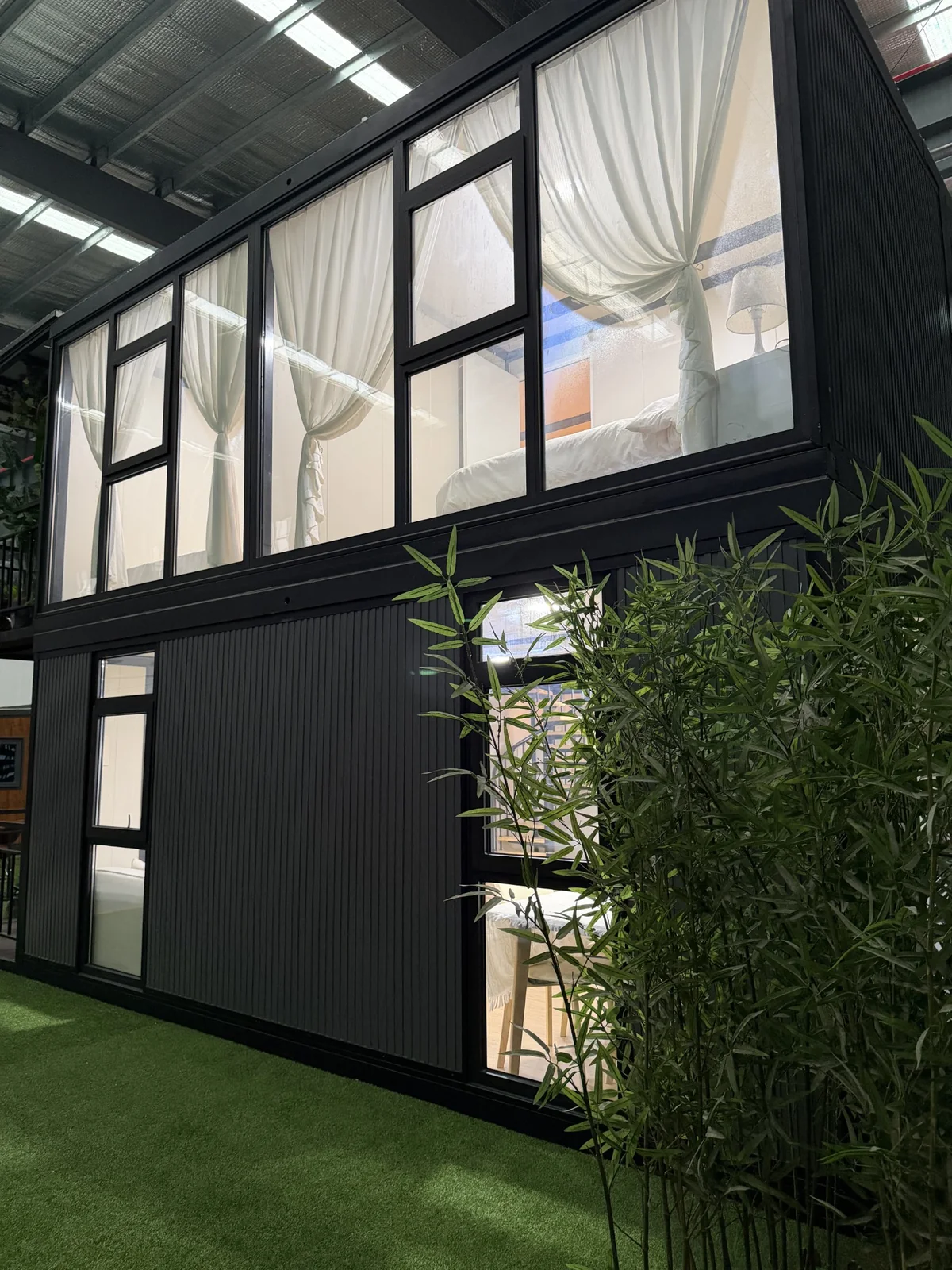 Large upper-level windows on custom double-storey expandable house